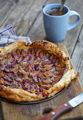 Delicious almond plum cake on puff pastry.