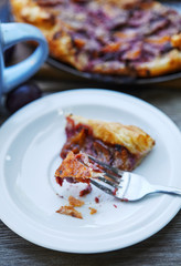 Delicious almond plum cake on puff pastry.