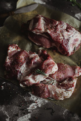 Food photography. Raw meat on craft bakery paper. Rustic color style image. Design of reciepe book cover