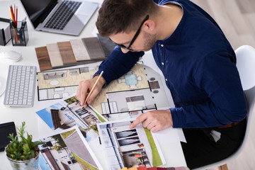 Real Estate Designer Working On Computer