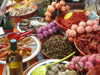 Olives, garlic and onion on a market in Provence, France