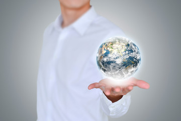 Closeup business man holds 3D earth.