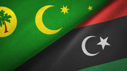 Cocos Keeling Islands and Libya two flags textile cloth, fabric texture