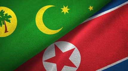 Cocos Keeling Islands and North Korea two flags textile cloth, fabric texture