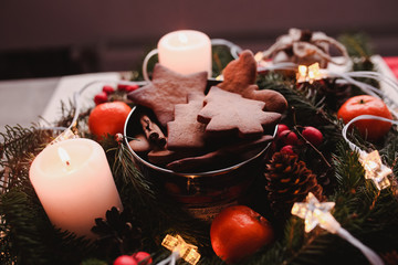 New Year's wreath with Gingerbread Cookies for xmas party. Christmas tree cake on the top of bunch