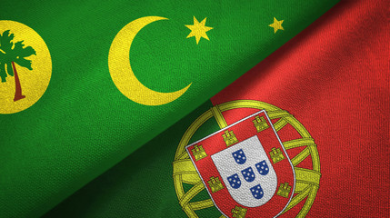 Cocos Keeling Islands and Portugal two flags textile cloth, fabric texture