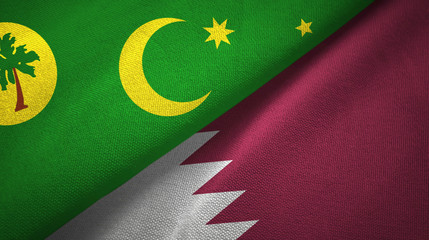 Cocos Keeling Islands and Qatar two flags textile cloth, fabric texture