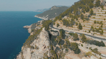 Fototapeta na wymiar Aerial View of beautiful rocky island of Mallorca in Spain. Drone footage of mountain island in the mediterranean sea