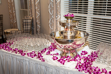 Champagne fountain elegantly displayed on a banquet table with glasses