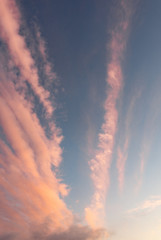 Blue sky with pink clouds at sunset in winter