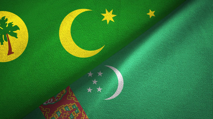 Cocos Keeling Islands and Turkmenistan two flags textile cloth, fabric texture
