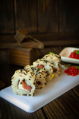 A california roll sushi with sesame seeds vertical image