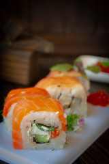 Salmon sushi set with red fish, salmon and red caviar. Vertical image