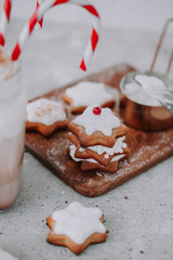 Homemade Christmas star shape gingerbread cookies with cheese cream