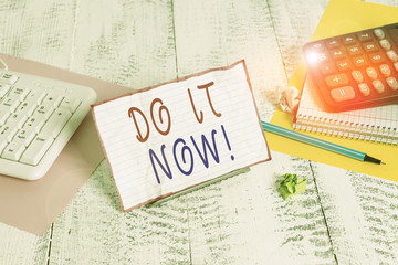 Conceptual hand writing showing Do It Now. Concept meaning not hesitate and start working or doing...