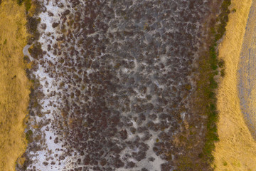 A large fresh water dam on Hindmarsh Island south of Adelaide in Australia that is dry due to drought and full of salt