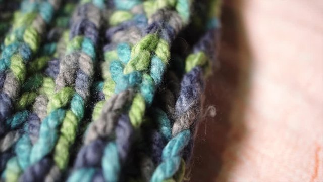 Brioche Stitch Knitting Thick Acrylic Synthetic Sheep's Yarn. Colorful Merino Wool. Sweater Texture. 4k UltraHD Footage Prores.