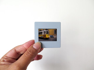 hand holding a photographic slide
