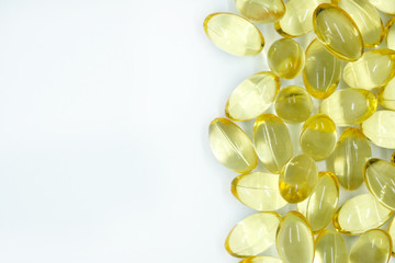Yellow transparent capsules. capsules with vitamin E. Omega 3 capsules.
