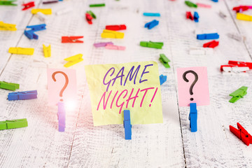 Word writing text Game Night. Business photo showcasing usually its called on adult play dates like poker with friends Scribbled and crumbling sheet with paper clips placed on the wooden table