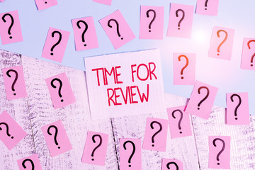 Word writing text Time For Review. Business photo showcasing review of a system or situation in its formal examination Scribbled and crumbling papers with thick cardboard above wooden table