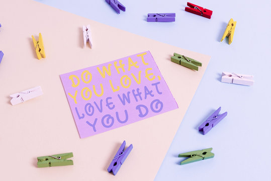 Conceptual hand writing showing Do What You Love Love What You Do. Concept meaning Pursue your dreams or passions in life Colored clothespin paper reminder with yellowblue background