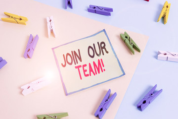 Conceptual hand writing showing Join Our Team. Concept meaning invite someone to work together for particular purpose target Colored clothespin paper reminder with yellowblue background