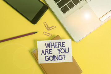 Conceptual hand writing showing Where Are You Goingquestion. Concept meaning used to ask someone the destination headed to Laptop smartphone clip pencil paper sheet colored background