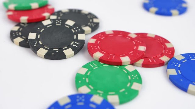 Poker Chips Thrown at White Table Slow Motion