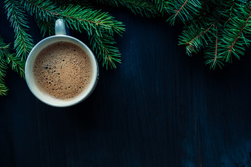 Close up of cup of coffee on black wooden background