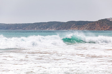 Beautiful view of the sea waves from the rocks in algarve, Portugal