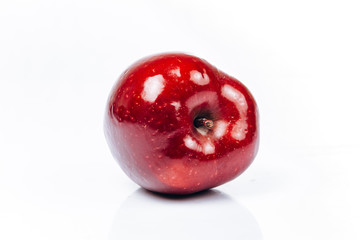 Fresh red apple on white background with beautiful reflection