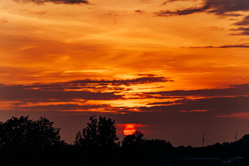 Beautiful sunset. Orange sunset. The moon at sunset