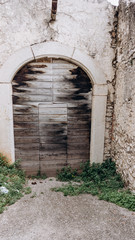 Fototapeta premium Arched medieval door with clipping path. Beautiful antique door