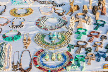 Plaster and stone souvenir replicas of  ankh, baboons, camels, pyamids, pharoahs, Gods and Goddesses