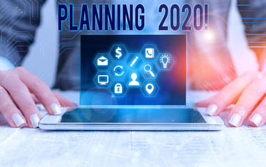 Conceptual hand writing showing Planning 2020. Concept meaning process of making plans for...