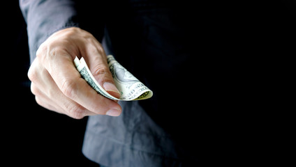 Business man's hand works for the money, He offer banknotes with partner for investment business, He count the dollar for bill payment. Exchange money. Financial concepts , Business Concept.