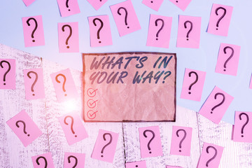 Writing note showing What S Is In Your Way question. Business concept for someone needs for a particular action Scribbled and crumbling papers with thick cardboard above wooden table