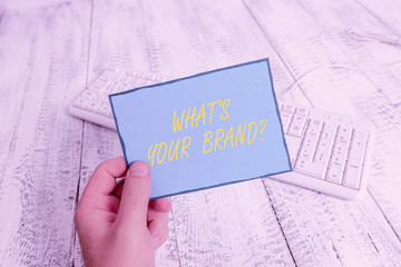 Writing note showing What S Your Brand Question. Business concept for asking about product logo...