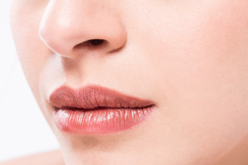 Perfect natural lip makeup. Close up macro photo with beautiful female mouth.