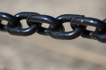 Close-Up of Links in a Painted Black Metal Chain