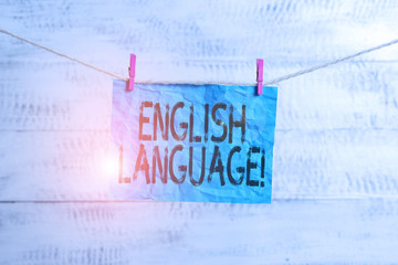 Text sign showing English Language. Business photo text third spoken native lang in world after Chinese and Spanish Clothesline clothespin rectangle shaped paper reminder white wood desk