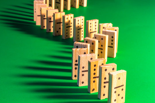 Wooden Dominoes with Long Shadows Standing Up