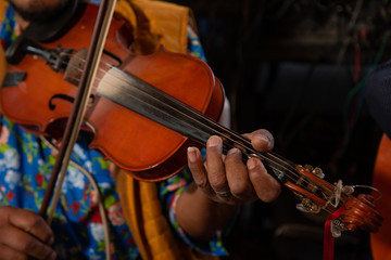 Mexican violinist musician, playing during the celebrations of a town in the center of Mexico