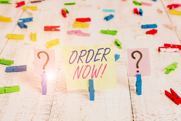 Word writing text Order Now. Business photo showcasing confirmed request by one party to another to buy sell Scribbled and crumbling sheet with paper clips placed on the wooden table