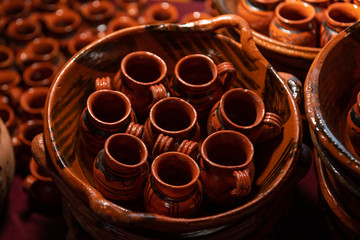 Traditional Mexican clay cups on clay dishes, Mexican crafts