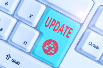 Conceptual hand writing showing Update. Concept meaning by adding new information or making corrections Up to date