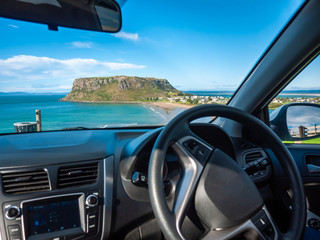 Stunning view from car front seat of The Nut -- a volcanic plug in town of Stanley outside window. Stanley, Tasmania, Australia