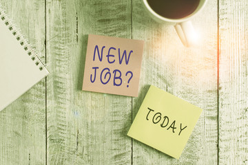 Text sign showing New Job Question. Business photo showcasing asking if a demonstrating got regular work to earn money Stationary placed next to a cup of black coffee above the wooden table