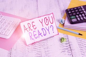 Conceptual hand writing showing Are You Ready Question. Concept meaning used telling someone start something when feel prepared Notepaper on wire in between computer keyboard and sheets